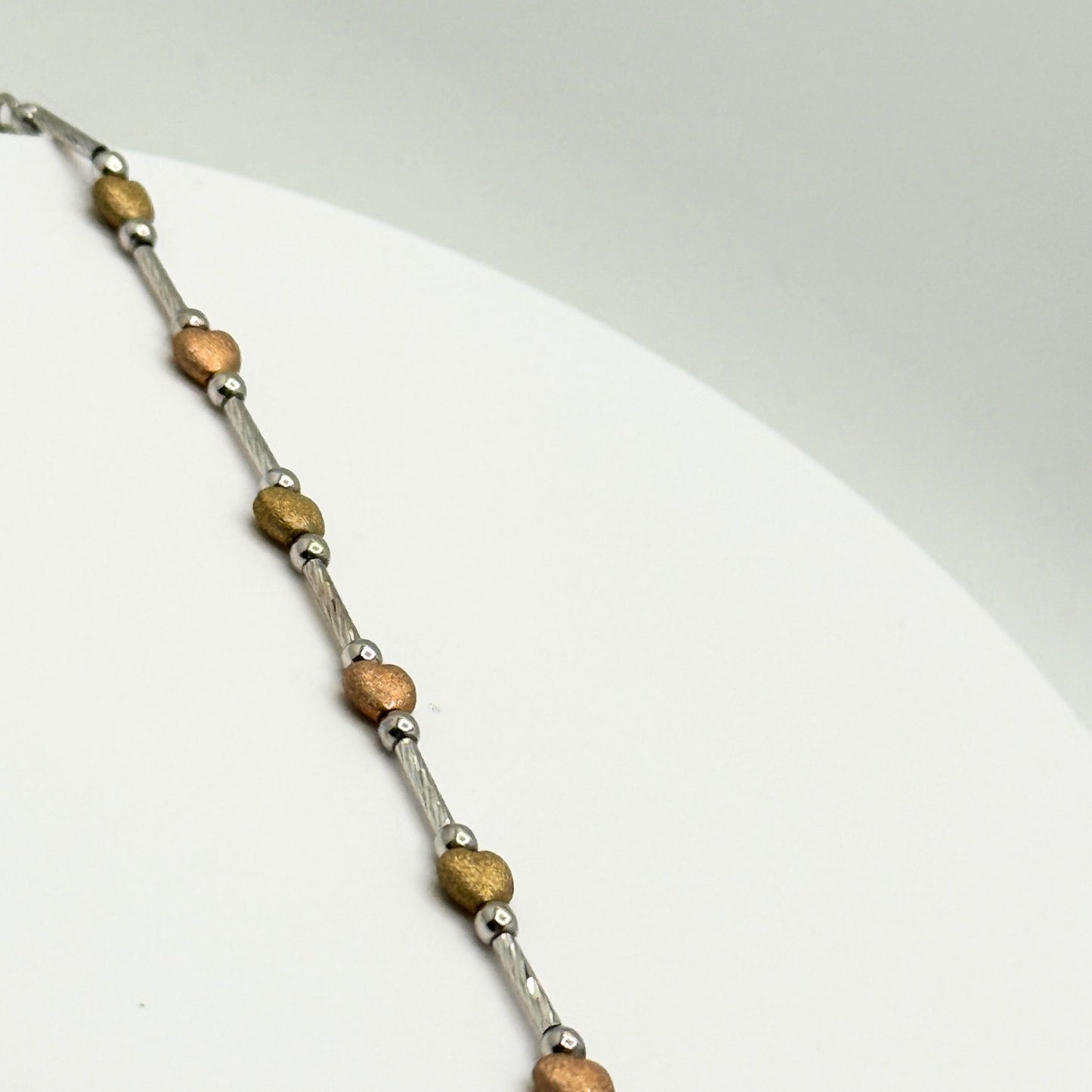 9ct White Gold Bracelet With Yellow & Rose Gold Hearts