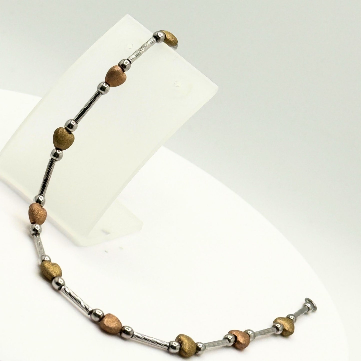 9ct White Gold Bracelet With Yellow & Rose Gold Hearts